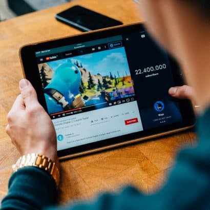 selective focus photography of person using tablet computer