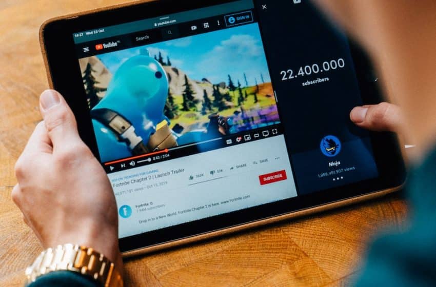 selective focus photography of person using tablet computer